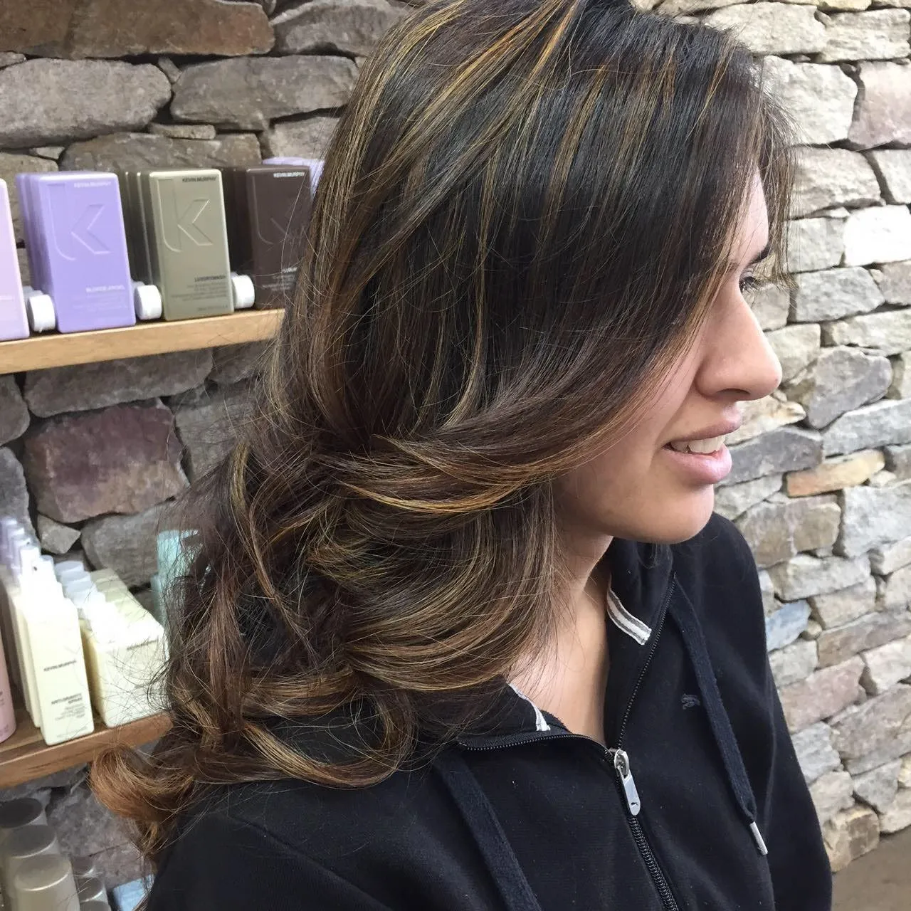 Brunette caramel balayage with wavy layers at DC Hair Lounge Baulkham Hills