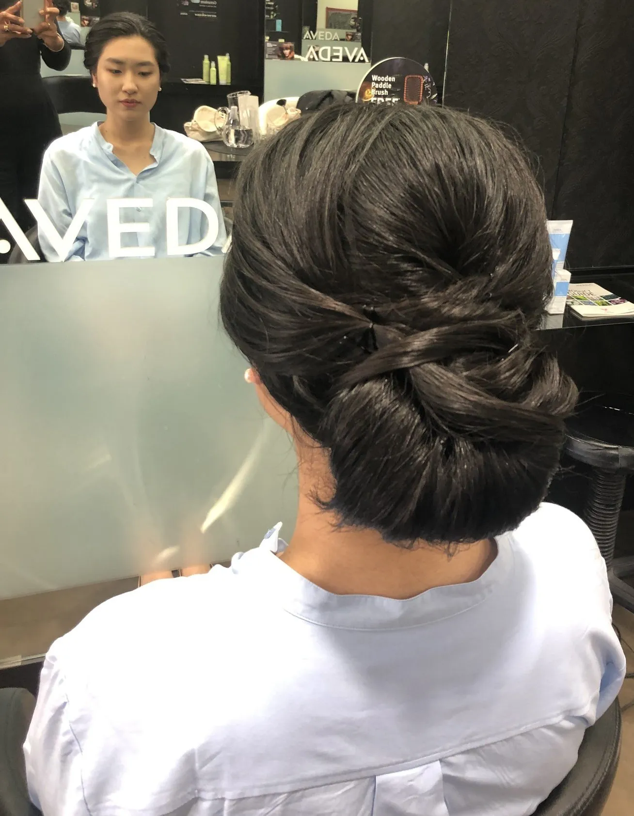 Dark sleek chignon updo at DC Hair Lounge Baulkham Hills