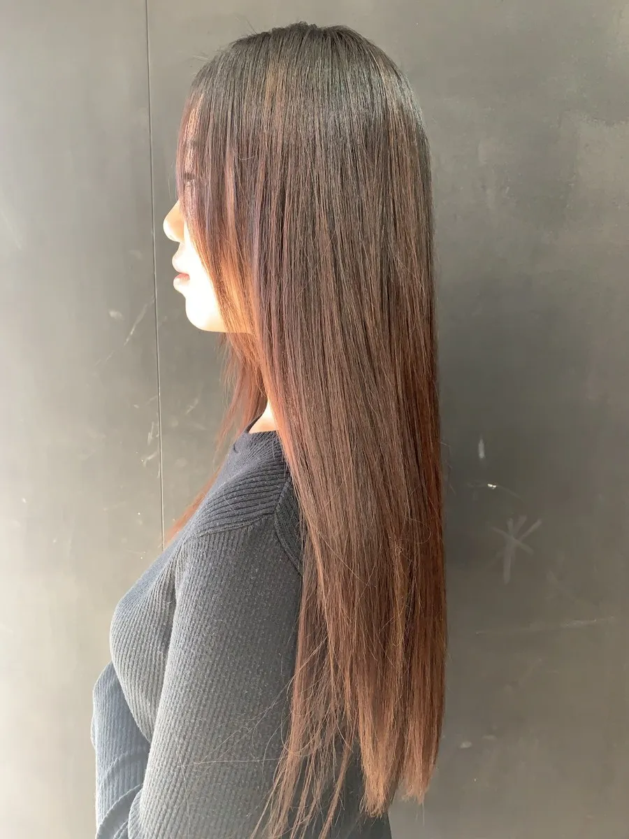 Ultra-straight dark brunette with copper tones at DC Hair Lounge